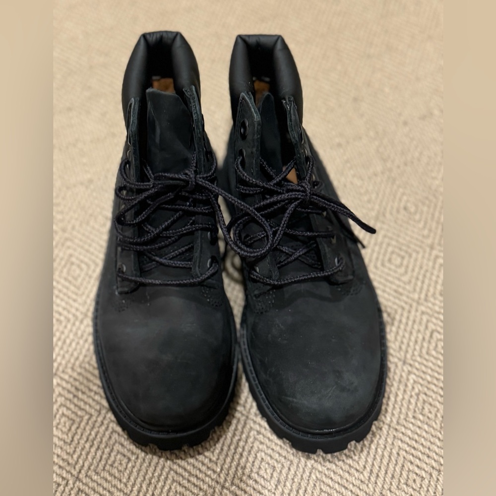 Little boys like new lace up Timberland boot.